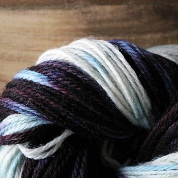 Wrapped skien of yarn showing dyed variegation.